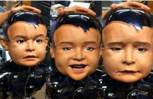 美國研製嬰兒機器人“迭戈-聖”能夠表達各種表情，圖左是困惑狀表情，圖中是高興的表情，圖右是哭泣的表情