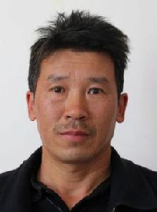 譚建榮[麗江民族中等專業學校黨委辦公室主任]