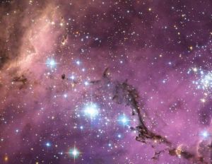 2013年，哈勃望遠鏡拍攝的星圖。距離地球20萬光年的大麥哲倫星雲是銀河系的衛星星系，其中恆星形成區的明亮星光如同萬花筒