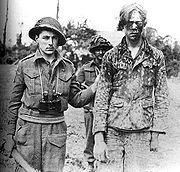 1944年8月9日，一個俘獲的希特勒青年團裝甲擲彈兵。加拿大的官方公共資料庫在照片拍攝一個正在討論中的行動的一個月才後加上了對這照片的說明，除了所屬師團外沒有任何有關這戰俘的資料。儘管在青年團已經停止殺害加拿大人，他的傷痕經常推測為毆打引致的。