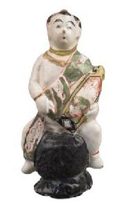 童子坐鼓凳抱琴俑 童子坐鼓凳抱琴俑