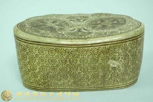 黃釉絞胎印花如意形枕