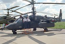 Ka-52是另一種Ka-50改裝版。特徵是並列式雙駕駛員和加強空對空作戰（直升機之間）。類似原始Ka-50，機鼻線條較圓滑以容納兩名駕駛，減少了一些駕駛艙裝甲和機頭雷達罩空間。Ka-52 保留了側面機炮和六個飛彈掛載點的設計。