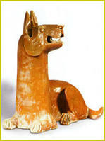 漢左臥姿紅釉陶犬