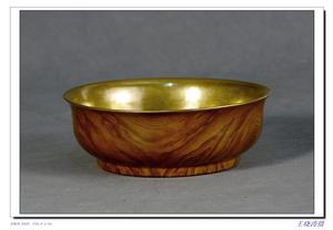清乾隆仿木釉金胎瓷碗