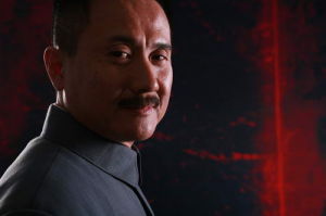 張志堅飾董建昌